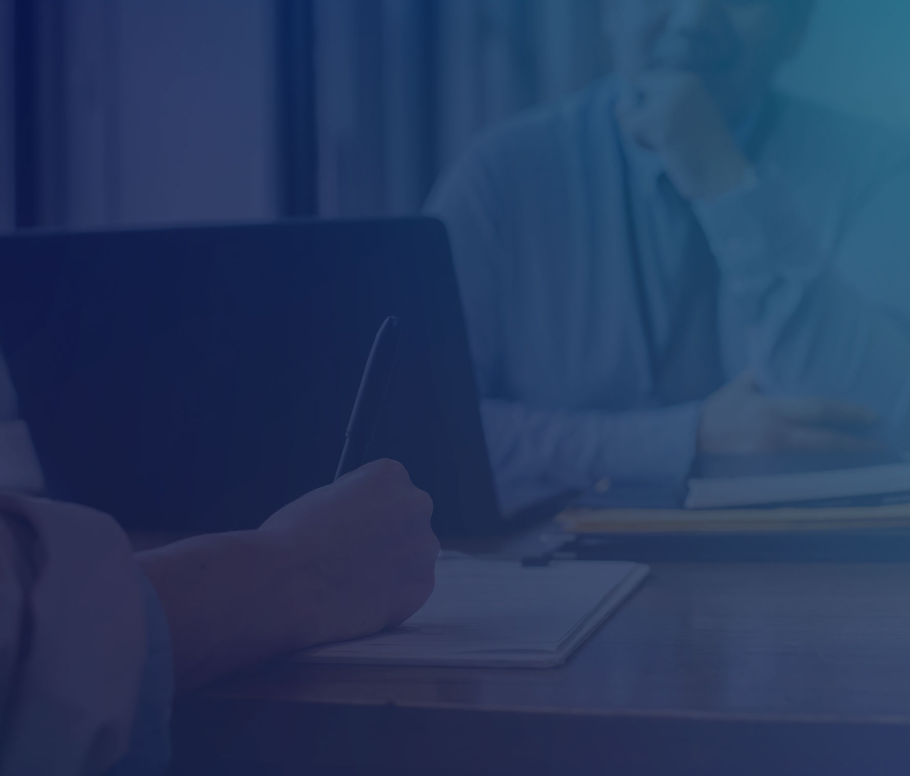 Man being interviewed by a person taking notes