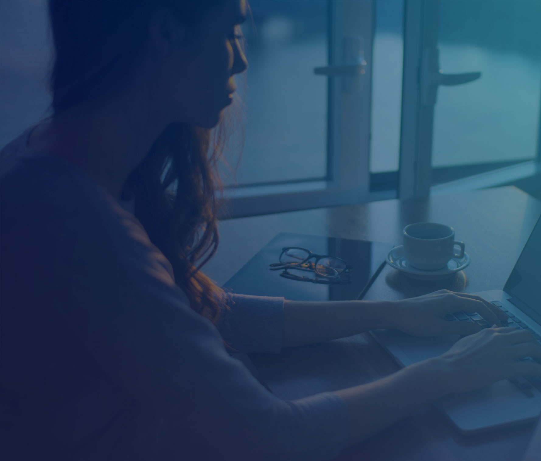 Woman typing on laptop
