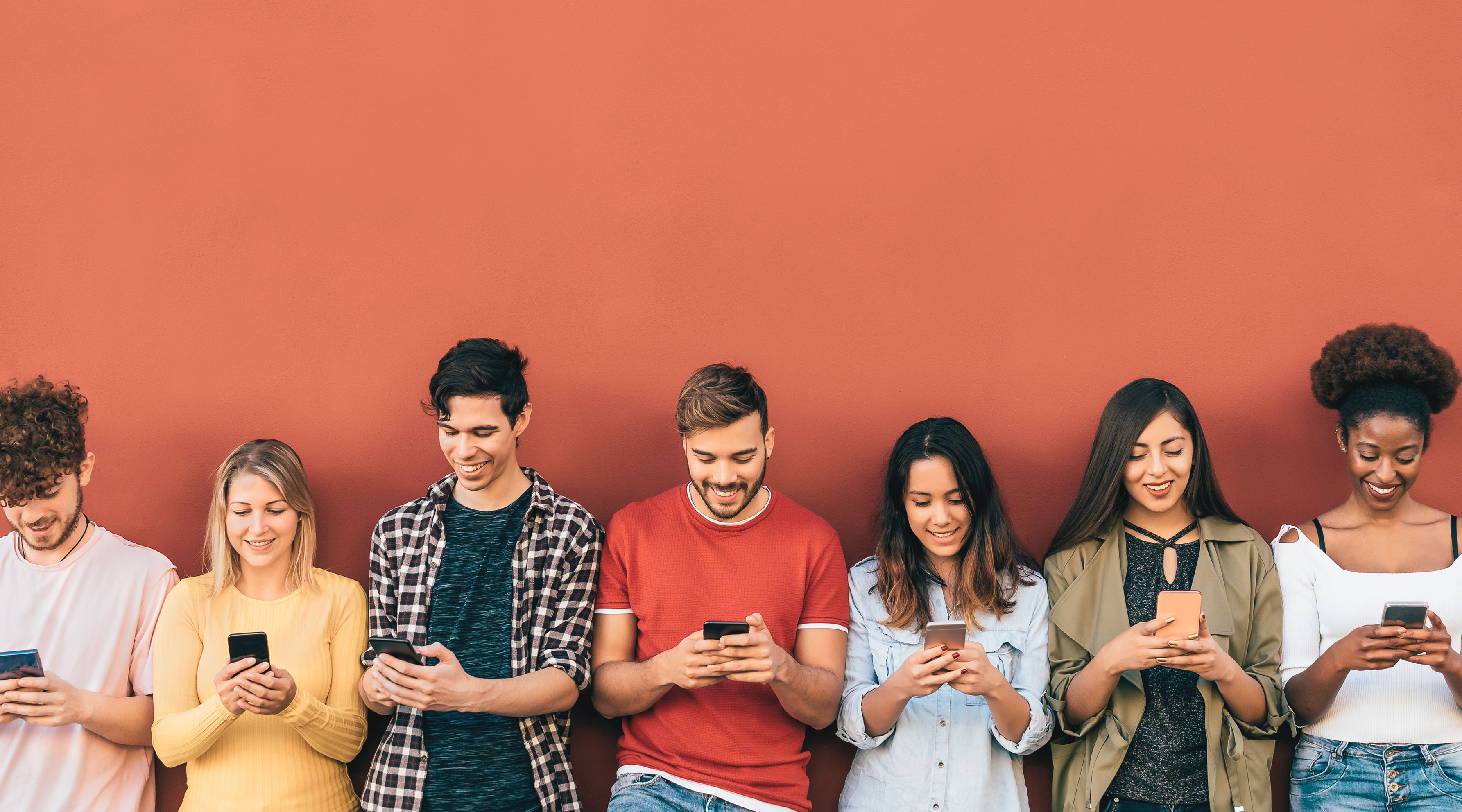 A group of Gen Z learners using their smart phones