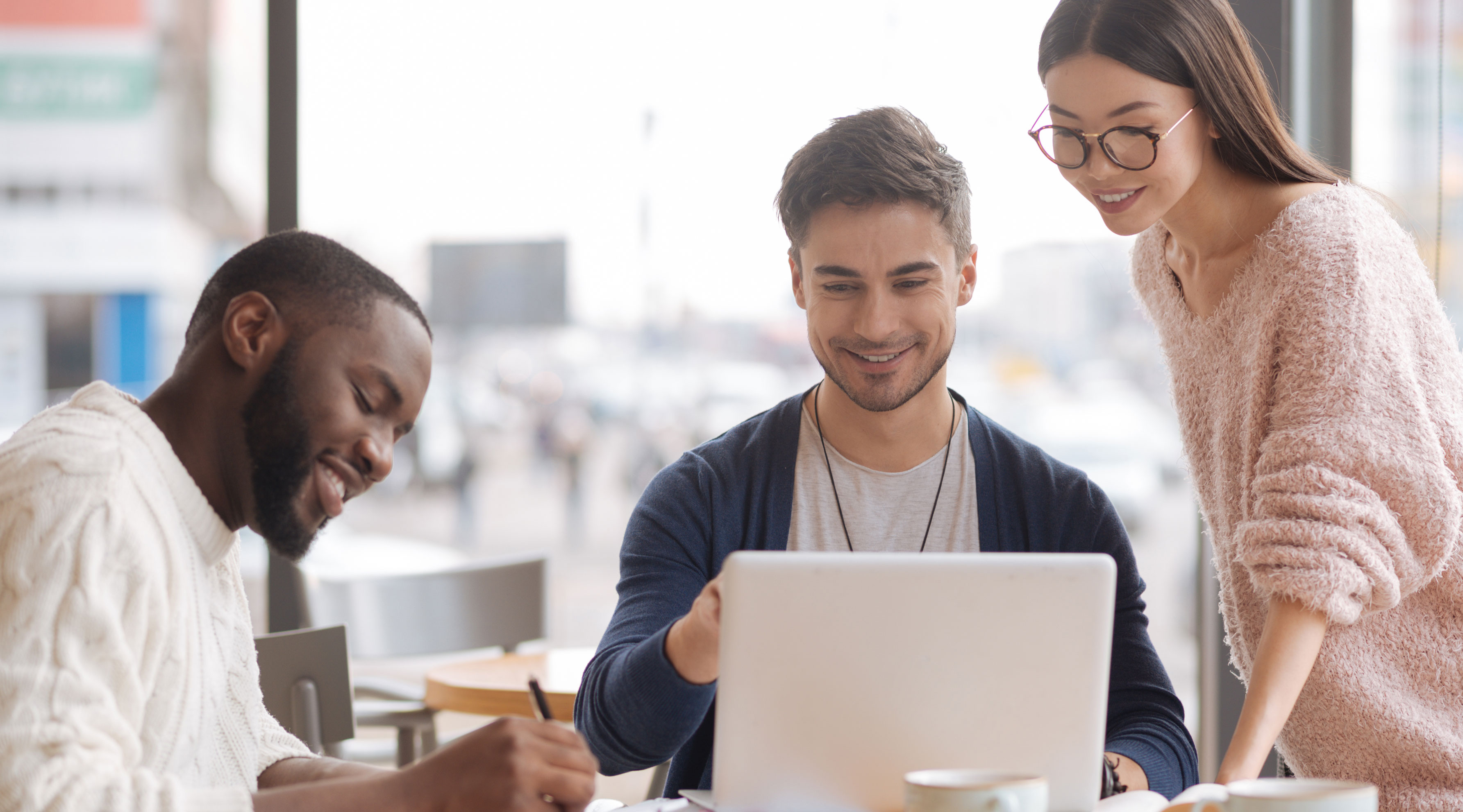 Three people collaborating about eLearning