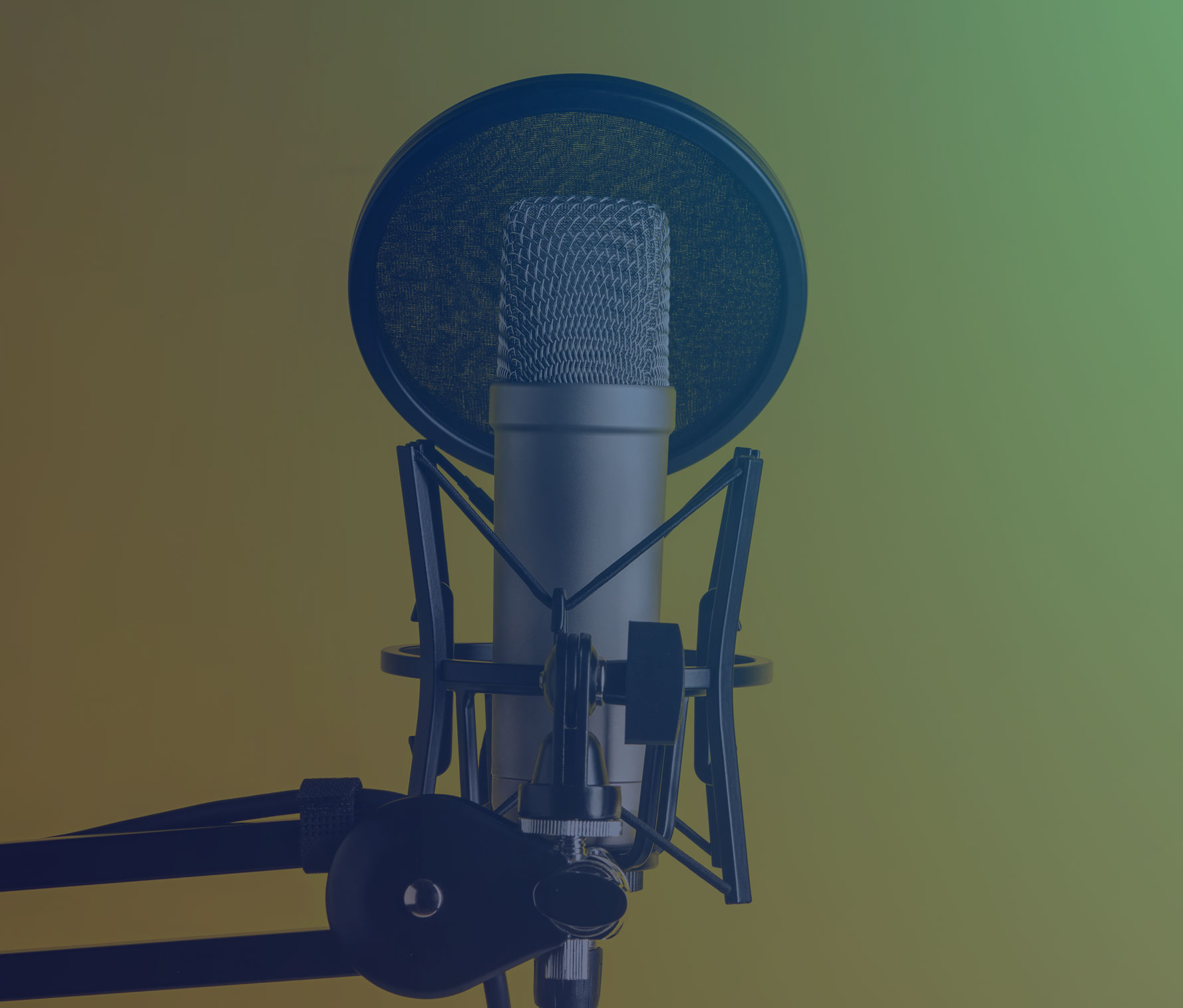 A professional condenser microphone with a pop filter and shock mount, set up on a boom arm against a bright yellow background. The image highlights audio recording equipment used for podcasting or voice-over work.