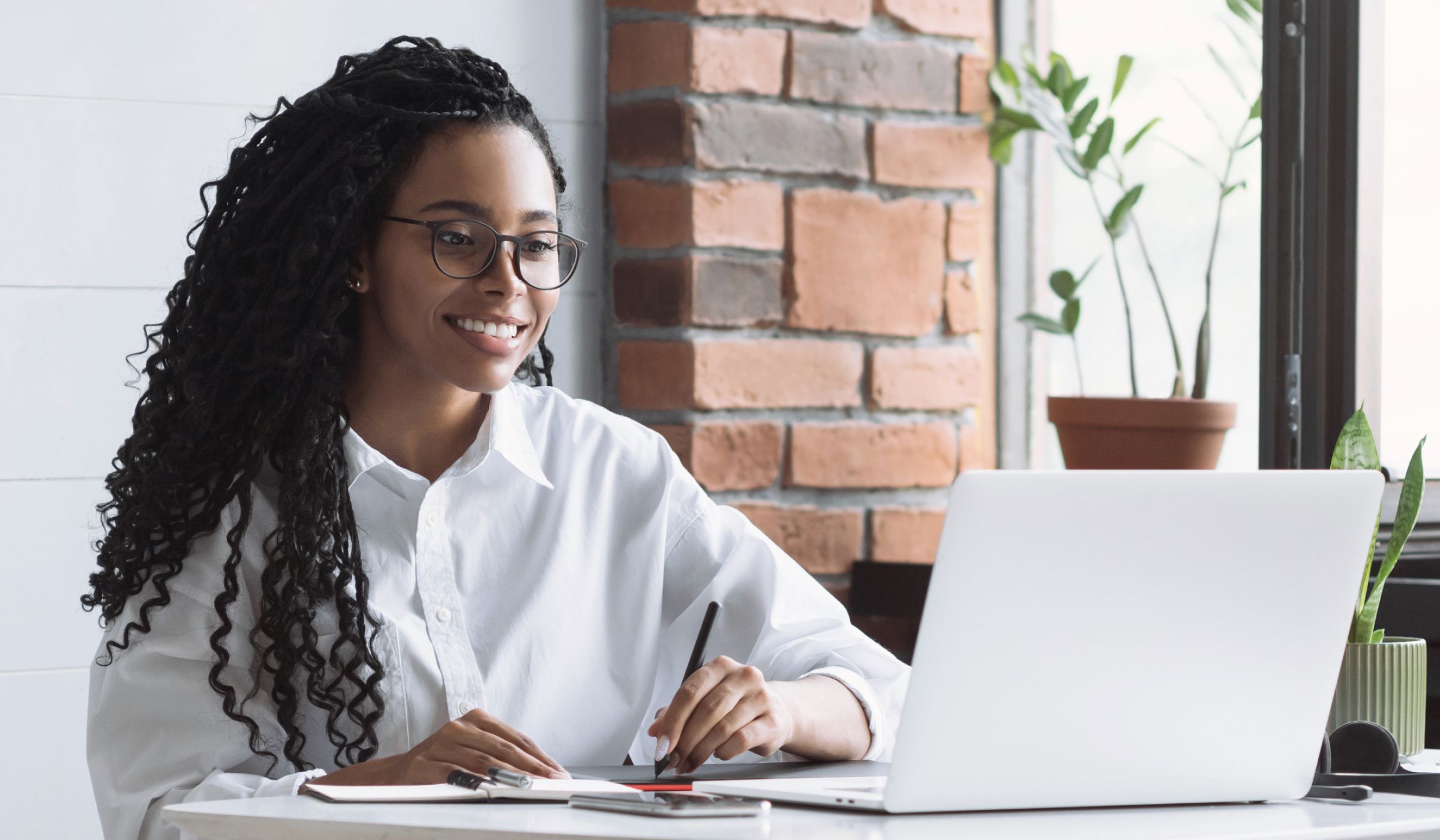 An association member researching LMS providers on a laptop computer.